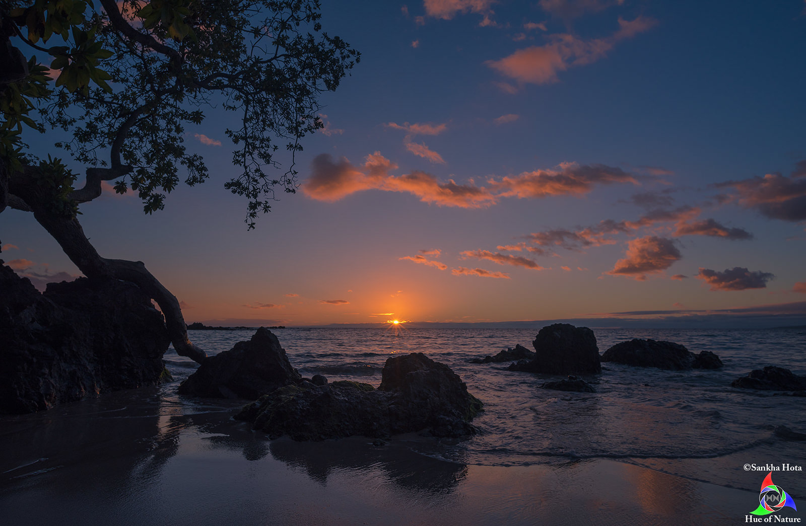 Sunset view from Mauna Kea Beach Hotel private beach